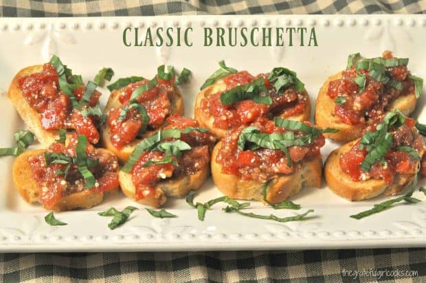 You'll love this Classic Bruschetta appetizer with tomatoes, basil, Parmesan, garlic, olive oil, and balsamic vinegar, served on garlic toasted baguette slice.