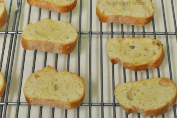 The baguette slices (crostini) are baked until crispy.