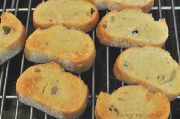 Toasted baguette slices are cooked to make them crispy for bruschetta toppings.