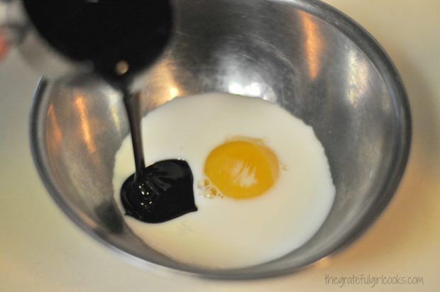 Molasses, egg yolk and milk are combined for gingerbread scones batter.