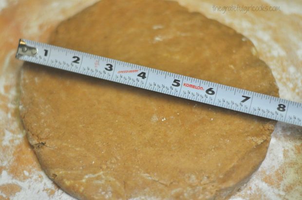 The dough for gingerbread scones is rolled into 8 inch circle.