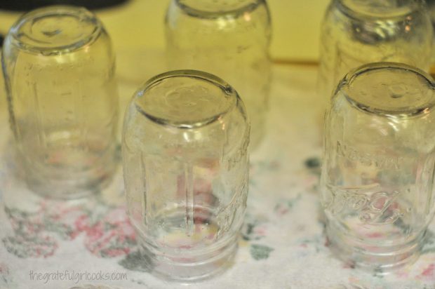 Canning jars being prepared for canning green beans.