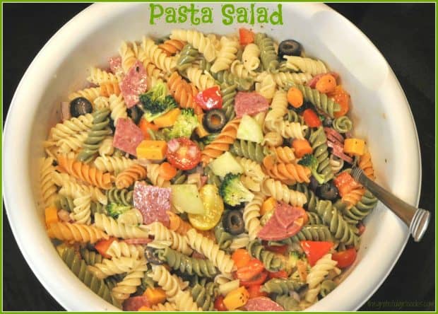 This quick (15 min.), and easy to make pasta salad with Italian dressing, salami, cheese, broccoli, olives and carrots will become a family favorite!