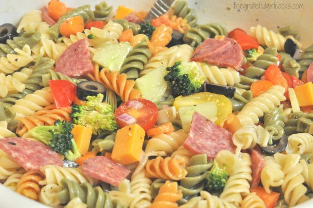 The pasta salad is dressed, and ready to serve!