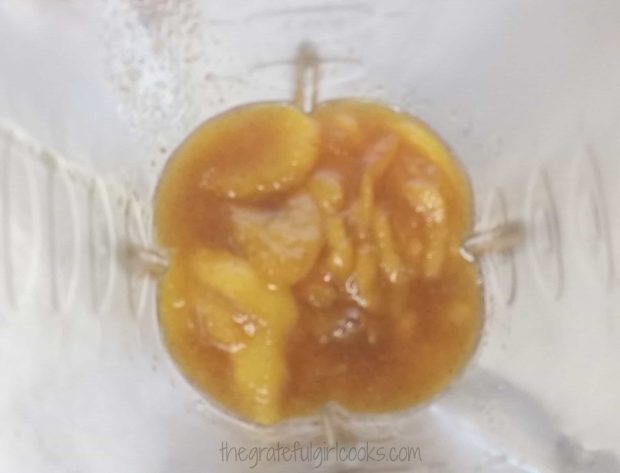 The cooked peach mixture is pureed in a blender.