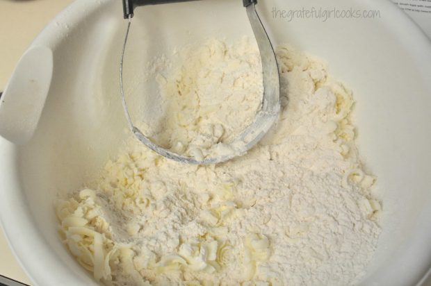 Using pastry cutter to blend in butter for biscuit dough