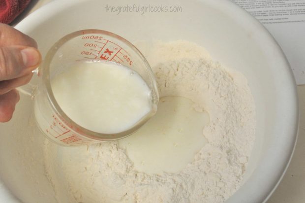Cold buttermilk added to flour in bowl