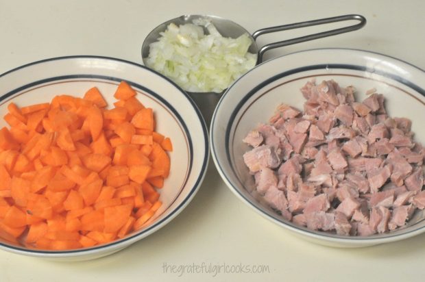 Chopped carrots, ham, onion and spices are ready to add to the split pea and ham soup.