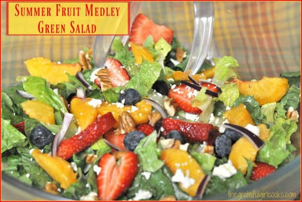 Mixed greens, strawberries, peaches, blueberries, feta, red onion and pecans combine to create a delicious, colorful, summer fruit medley green salad!