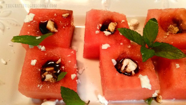 You can see the balsamic vinegar inside each watermelon appetizer.