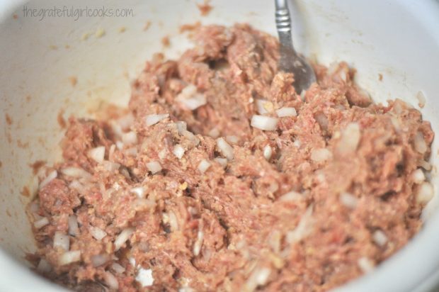 Mixing ingredients for Swedish meatballs in large mixing bowl.