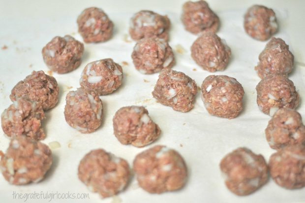 Meatballs are formed out of hamburger meat and spices, etc.