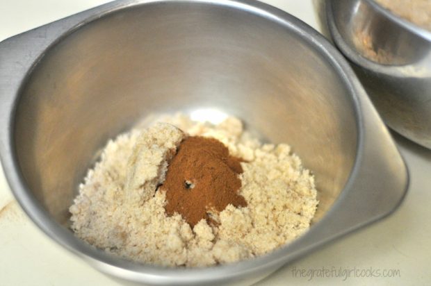 Some of the crumb mixture is mixed with cinnamon.