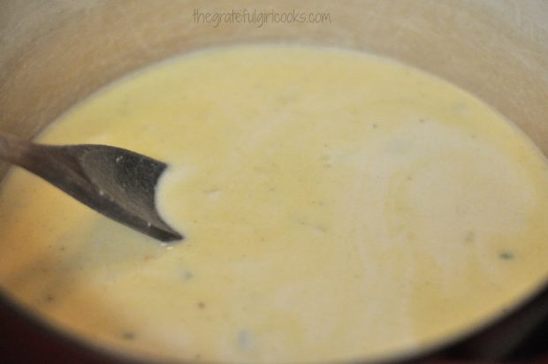 Soup base for chicken gnocchi soup, cooking in large saucepan.