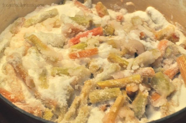 The rhubarb and sugar are combined in large Dutch oven.