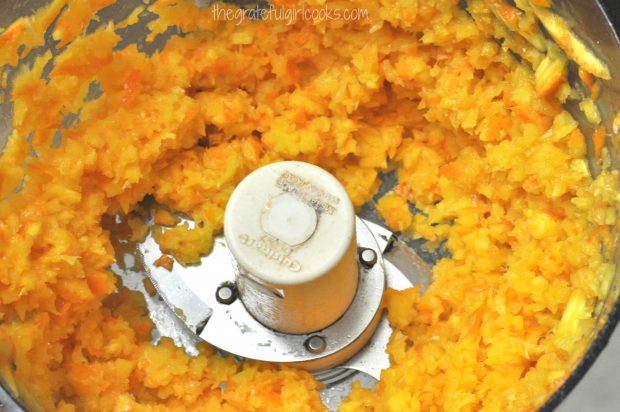 Whole oranges are pulverized in food processor