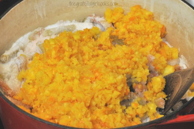 Processed oranges added to the rhubarb and sugar mixture in the Dutch oven.
