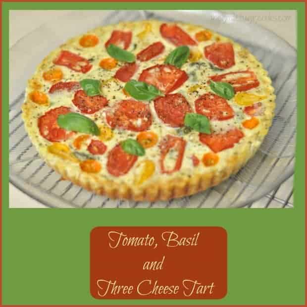 Tomato Basil Three Cheese Tart has a flaky crust, tomatoes, Ricotta, Parmesan, Mozzarella cheese, Italian spices, and is perfect for breakfast, lunch OR dinner!