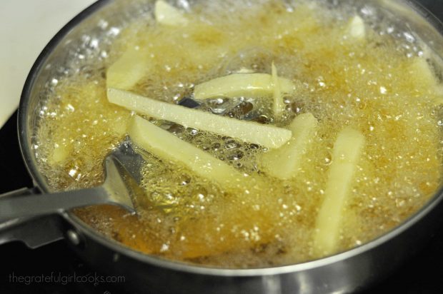 French fries are cooked in oil for the first fry.