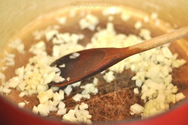 Chopped onions are cooked in olive oil for soup