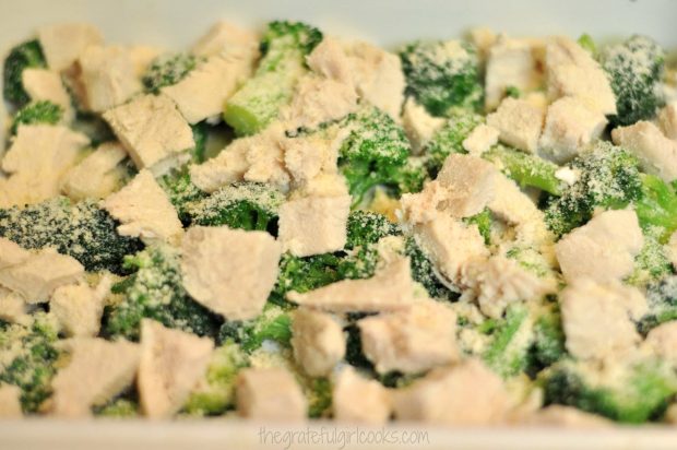 Chicken breast cubes placed on top of broccoli