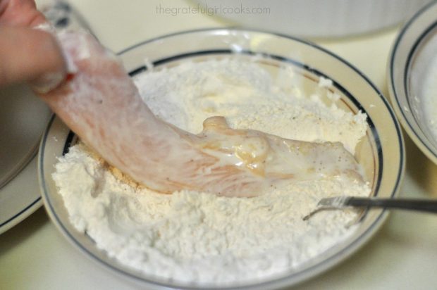Chicken breast strip dredged in flour for honey bbq chicken strips.