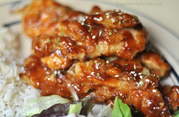 Honey BBQ Chicken Strips on plate, with rice and salad