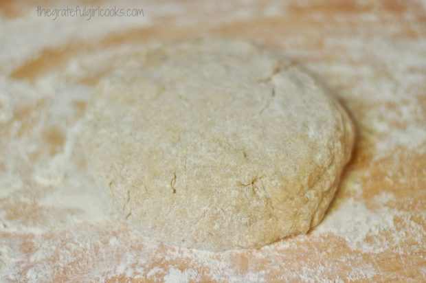 Doughnut dough is shaped into a circle before cutting out shapes.