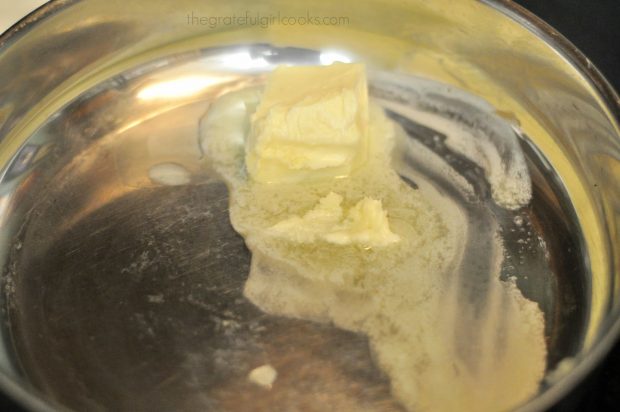 Butter is melted to make sauce for Shrimp Penne Pasta Alfredo.