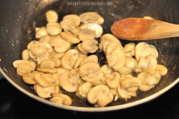 Mushrooms cooking in skillet