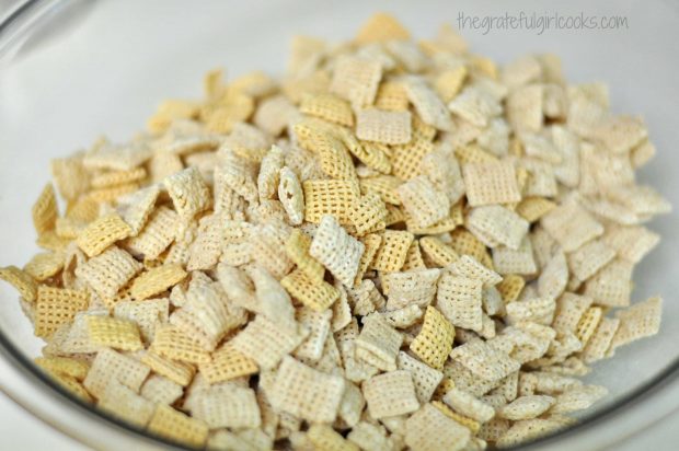 The different crispy cereals for muddy buddies are placed into a large bowl.