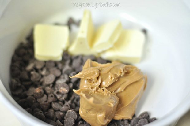 Chocolate, peanut butter and butter are placed in bowl in microwave to melt.