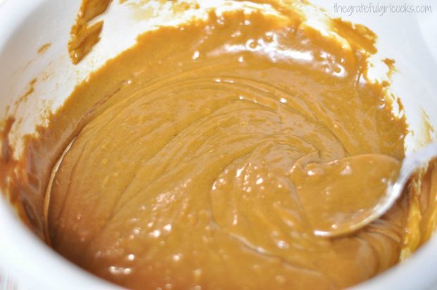 Gingerbread muffin batter is reading to put into muffin cups to bake.