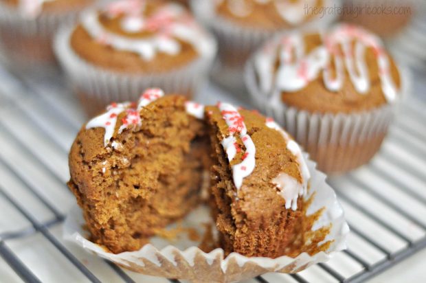 One of the gingerbread muffins is cut in half to see inside.
