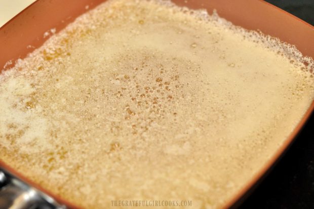 Melted butter for cookie dough in copper skillet