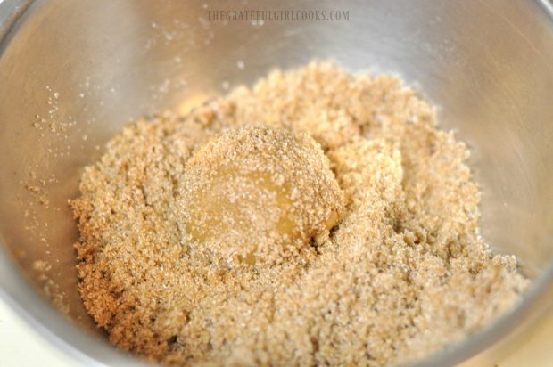 Cookie dough ball rolled in brown sugar mixture