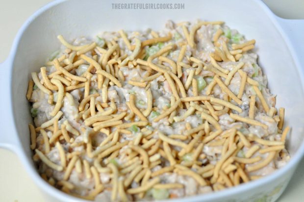 Tuna cashew casserole with noodles on top of dish