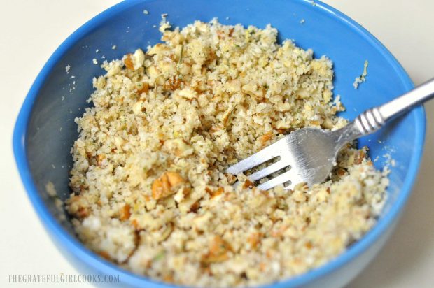 The pecan crumb topping for the fish is mixed together in a blue bowl.