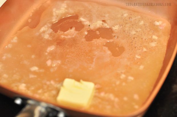 Butter is added to the lemon wine sauce in skillet.