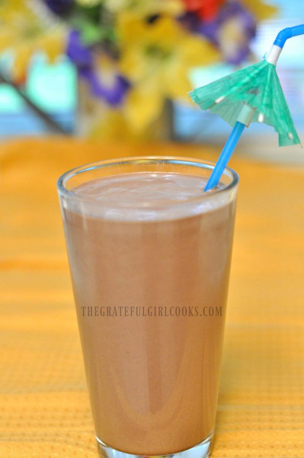 Creamy chocolate peanut butter smoothie, served with a tropical umbrella straw!