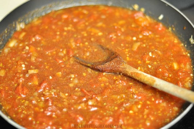 The sauce for the ranch beans is cooked in large skillet.