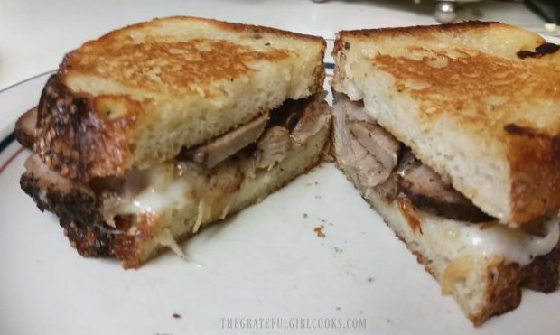 The grilled pork tenderloin sandwich, cut in half to serve.