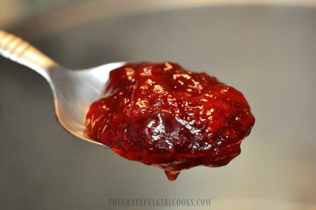 Spoonful of homemade, canned strawberry jam