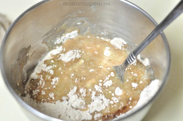 Streusel topping for carrot cake muffins being mixed in bowl