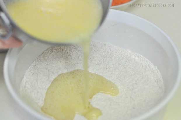 Eggs poured into dry ingredients in white bowl