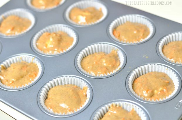 Muffin cup holders filled with carrot cake batter
