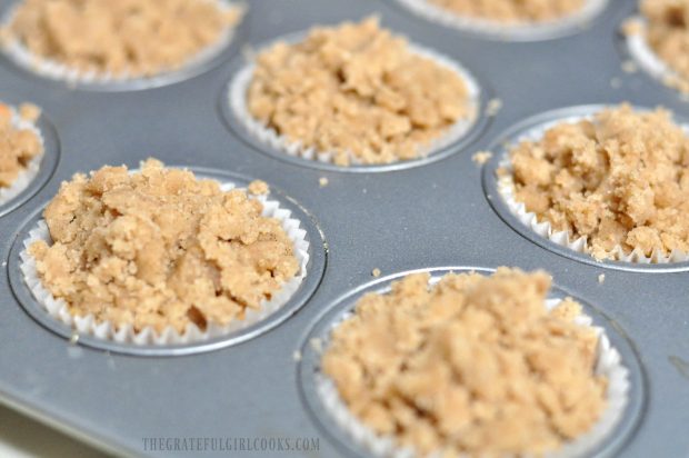 Streusel crumb topping added to muffin tops