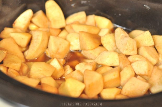 Apple chunks are ready in the slow cooker to make chunky crock pot apples!