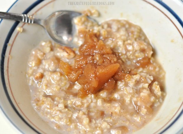 Chunky Crock Pot Apples are served on top of a bowl of oatmeal.