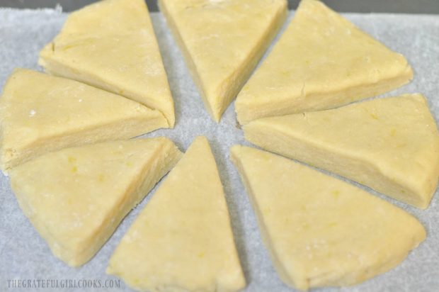 Scone wedges are placed on parchment paper to bake